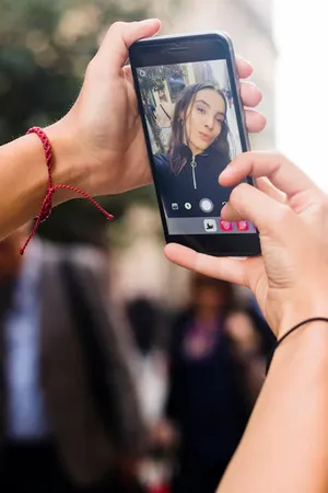 Person watching a live video on a mobile phone