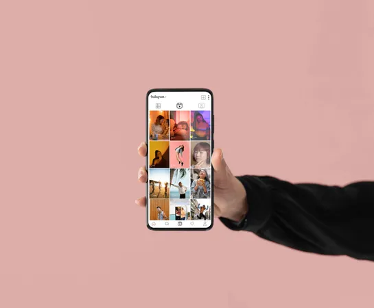 Close-up of a hand holding a phone with an Instagram account open