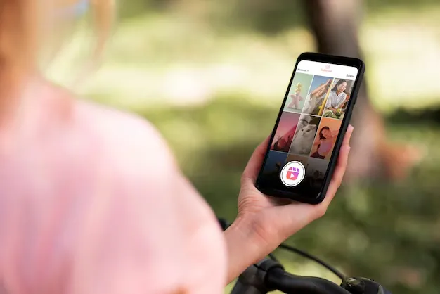 Woman watching short video reels on her smartphone.